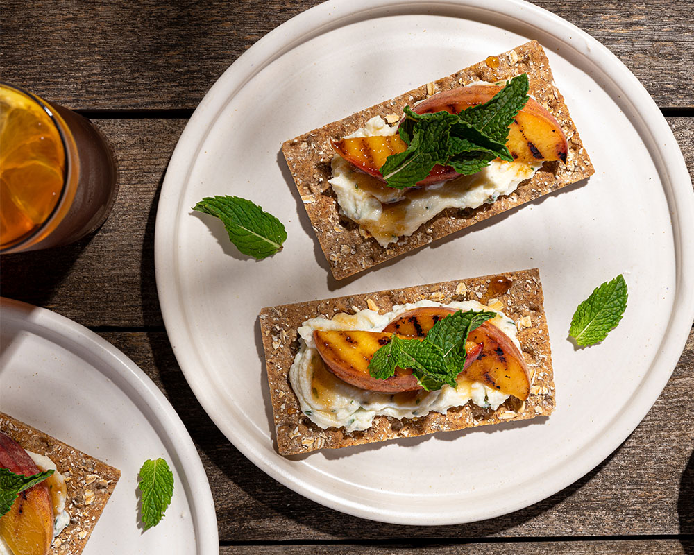 Wasa Multigrain Cracker with Peach Ricotta Hot Honey