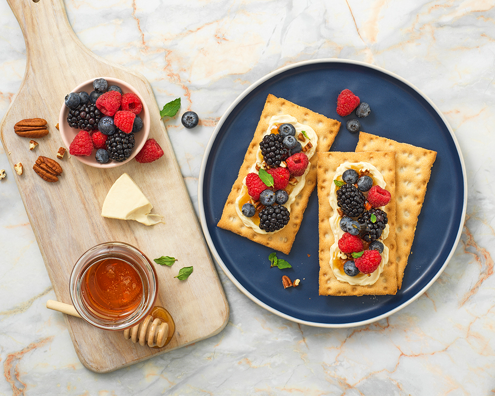 Wasa Gluten Free crackers with cheese, berries, honey